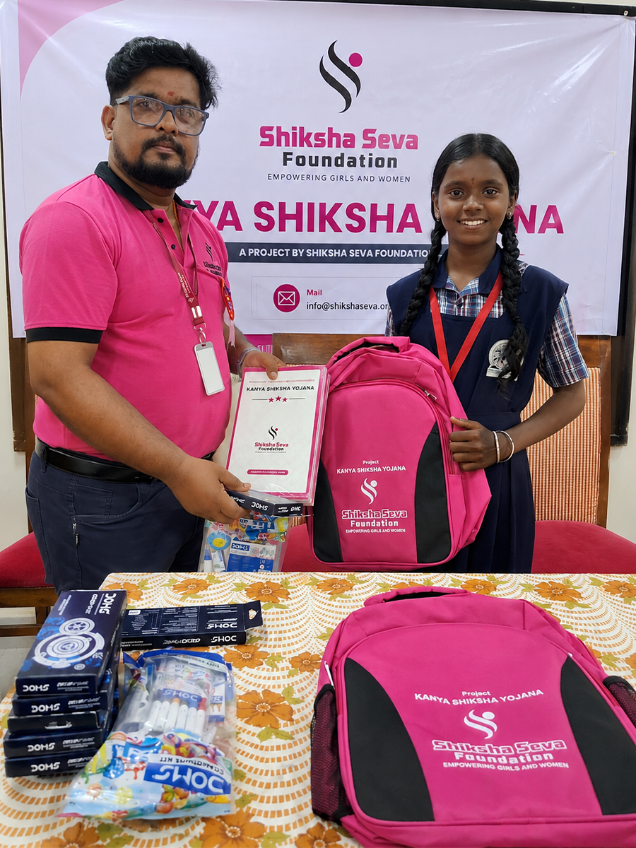 Children receiving school kits